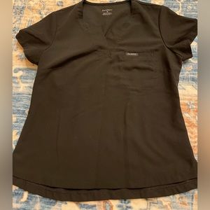Black jaanuu scrub top in size medium. Hardly worn
